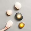 Lampada da parete PebbleHue – La magia della costa in casa