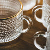 Tazza da tè in vetro LuxeSip - Design goffrato con linee dorate