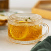 Tazza da tè in vetro LuxeSip - Design goffrato con linee dorate
