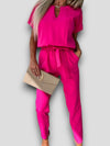 Zwarte Dames Jumpsuit Kort met V-hals en Verstelbare Taille – Feestelijke en Comfortabele Stijl - Roze